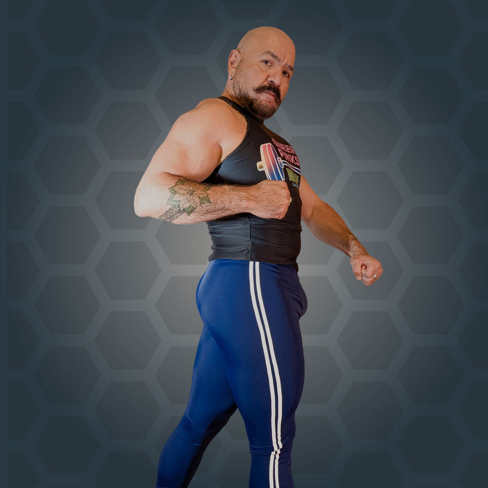 Midnight Cobra tights worn with a dark tank, front view, arms flexed