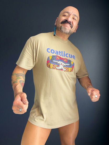Front view of the faded khaki Coatlicue tee, showing the blue lettering and the serpent graphic across the chest.