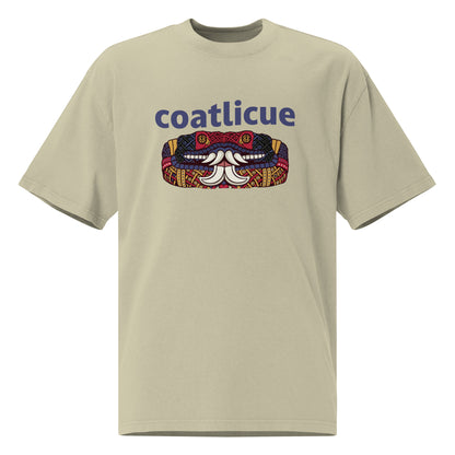 Faded eucalyptus Coatlicue oversized distressed tee, front view, showing the blue lettering and serpent graphic across the chest.